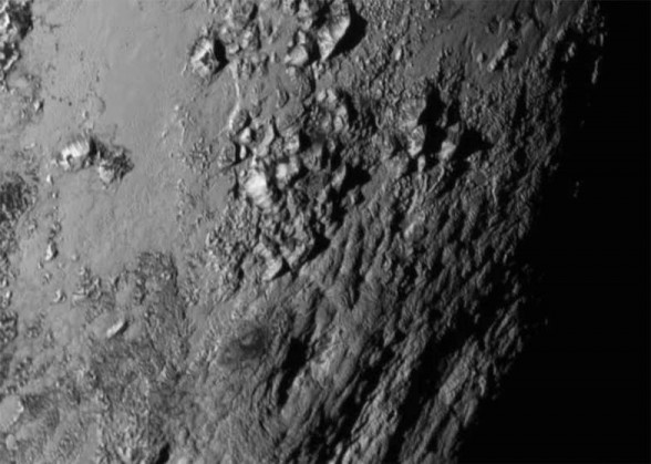 IN SPACE - JULY 14: In this handout provided by the National Aeronautics and Space Administration (NASA), a close-up image of a region near Pluto's equator shows a range of mountains rising as high as 11,000 feet (3,500 meters) taken by NASA's New Horizons spacecraft as it passed within 7,800 feet of the dwarf planet on July 14, 2015. The 1,050-pound piano sized probe, which was launched January 19, 2006 aboard an Atlas V rocket from Cape Canaveral, Florida, zipped by the planet yesterday. (Photo by NASA/APL/SwRI via Getty Images)