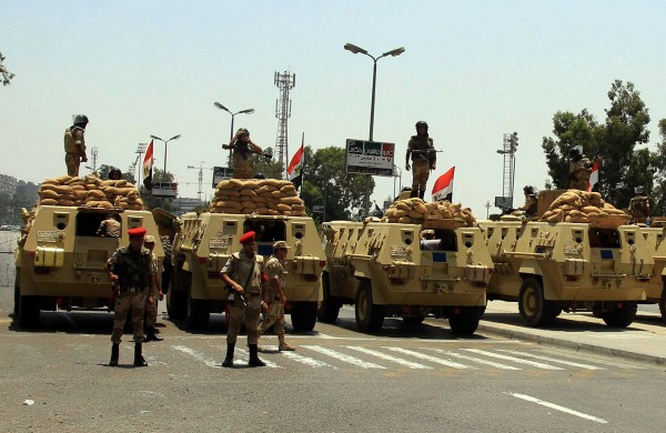 Egyptian Army armoured vehicles sit parked at a checkpoint in the district of Nasser City the morning after former Egyptian President Mohammed Morsi, the country's first democratically elected president, was ousted from power on July 4, 2013 in Cairo, Egypt. Adly Mansour, chief justice of the Supreme Constitutional Court, was sworn in as the interim head of state in ceremony in Cairo in the morning of July 4, the day after Morsi was placed under house arrest by the Egyptian military and the Constitution was suspended. UPI/Ahmed Jomaa