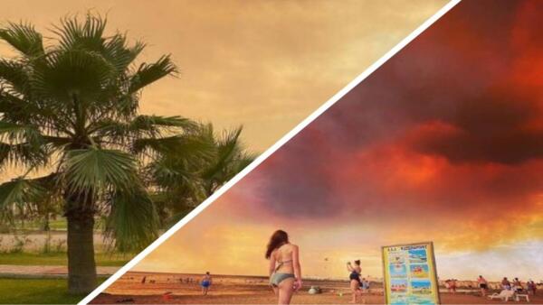 Русскоязычные туристы в Турции фотографируются на фоне яркого от пожаров неба