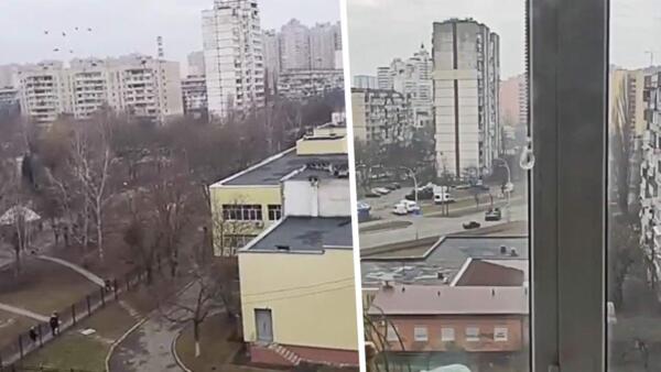Военная техника вошла в Киев. На кадрах -- бронемашины проезжают в дворах под звуки стрельбы