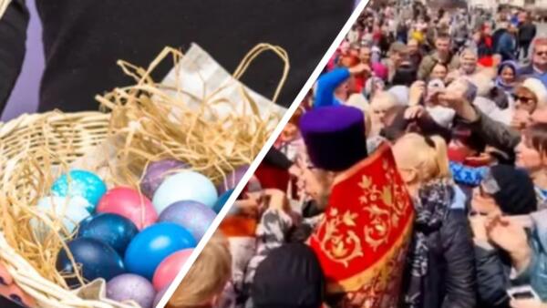 Толпа окружила священнослужителя на раздаче пасхальных яиц во Владивостоке. Устроили давку за угощение