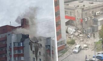 На видео из Белгорода обломок ракеты падает на многоэтажку. На кадрах — дым, повреждённые авто и дом
