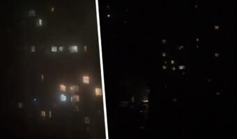 На видео жители Киева поют и кричат из окон многоэтажек, радуясь подаче электричества